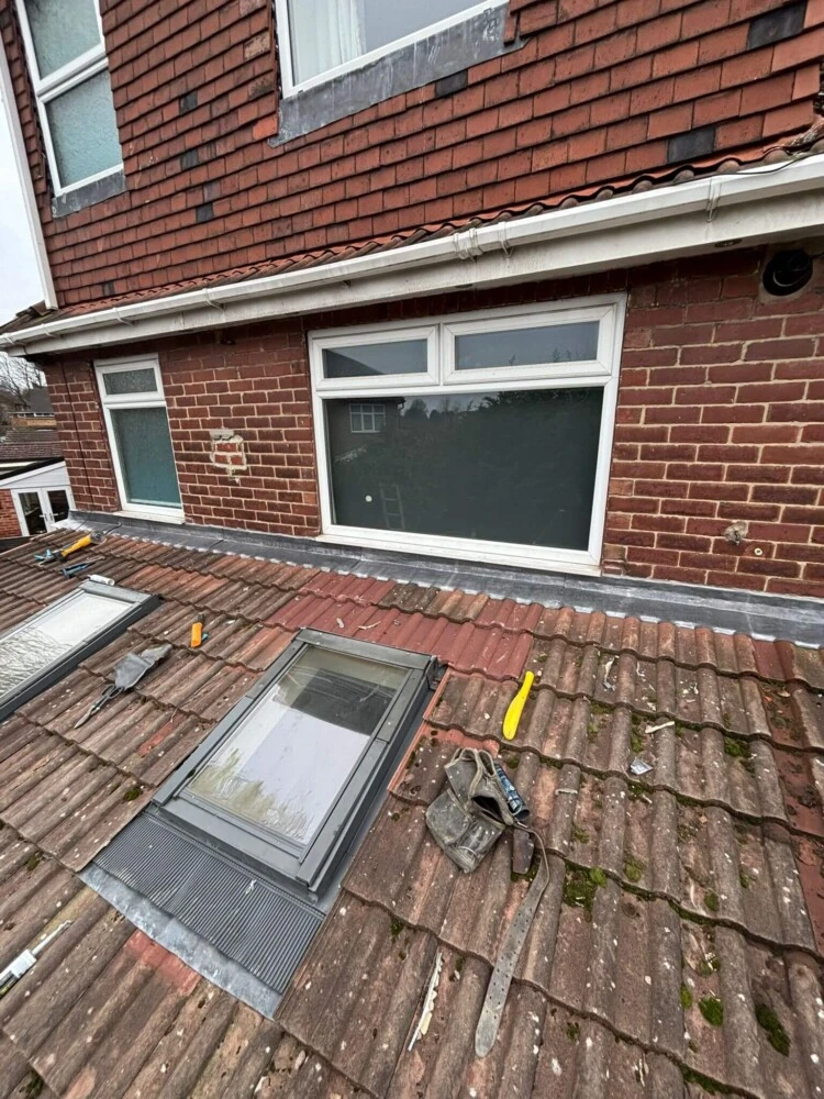 Red brick Leeds house with new uPVC fascia and guttering fitted by CD Roofing LTD